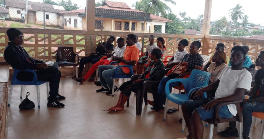 youth in Liberia attending a meeting related to empowerment